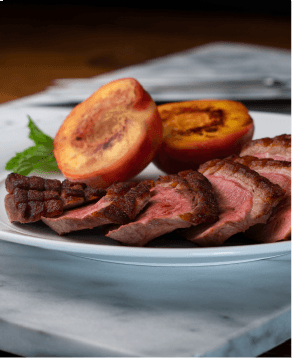Seared duck breast with roasted peaches